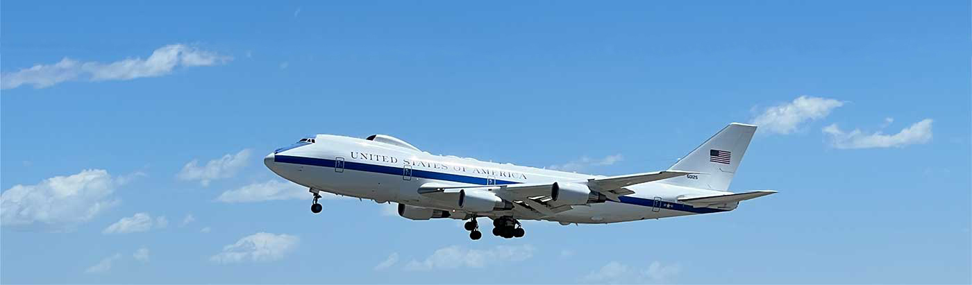 airforce one jet flying through the blue sky